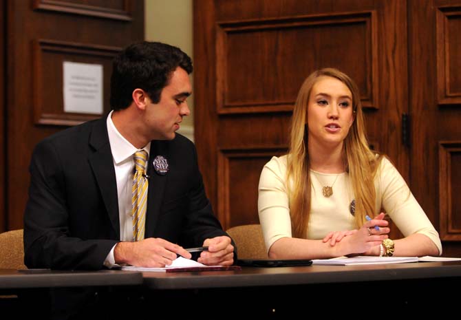 The Next Step campaign candidates Clay Tufts (Left) and Taylor Lambert (right) discuss possible initiatives Monday, March 17, 2014 during the 2014 Student Government Debate in the Holliday Forum.