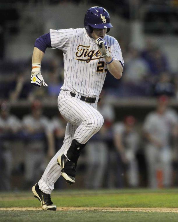 LSU freshman outfielder Jake Fraley runs to first base Wednesday, March 19, 2014 during the Tigers' 9-0 victory against South Alabama at Alex Box Stadium.