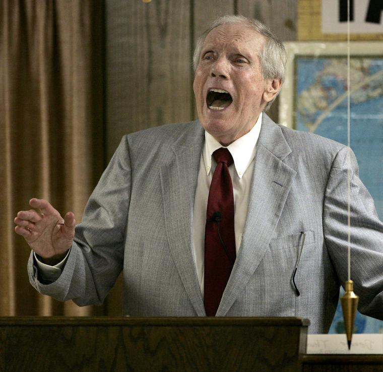 FILE - In this March 19, 2006 file photo, the Rev. Fred Phelps Sr. preaches at his Westboro Baptist Church in Topeka, Kan. Phelps, the founder of the Kansas church known for anti-gay protests and pickets at military funerals, died late Wednesday, March 19, 2014, his family said. He was 84. (AP Photo/Charlie Riedel, File)