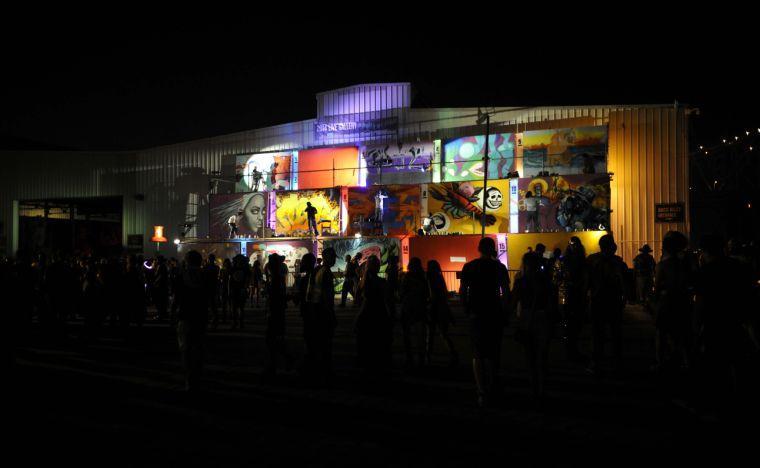 The graffitti wall is illuminated at Buku Music + Art Project on Friday, March 21, 2014 at Mardi Gras World in New Orleans.