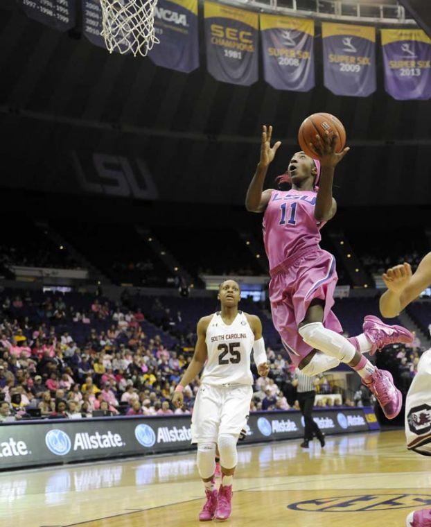 LSU freshman guard Raigyne Moncrief (11) drives to the basket Sunday, Feb. 16, 2014 in the first half of a game against South Carolina in the PMAC. The Tigers trail the Gamecocks 24-32 at half.