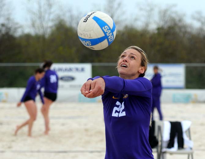 LSU senior sand volleyball player Kaitlin Hatcher (22) bumps the ball Wednesday, March 26, 2014, during the Tigers' 3-2 lost against Tulane at Coconut Beach Sand Volleyball Complex.