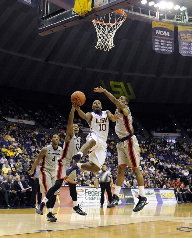 LSU senior guard Andre Stringer (10) weaves toward the basket Saturday, March 8, 2014 during the Tigers' 61-69 loss to Georgia in the PMAC.