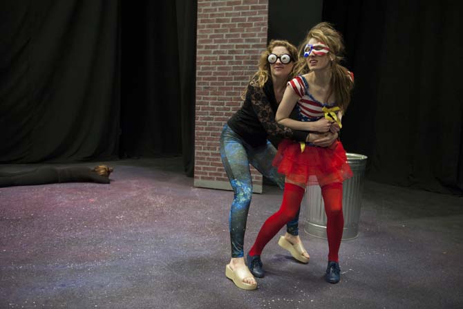 Spectator (left, theatre senior Jennifer Downes) wrestles with Liberty Lady (right, theatre junior Yvonne Bourgeois) Sunday, March 9, 2014 during a dress rehearsal of Vampire Cowboy in the Music and Dramatic Arts Building.