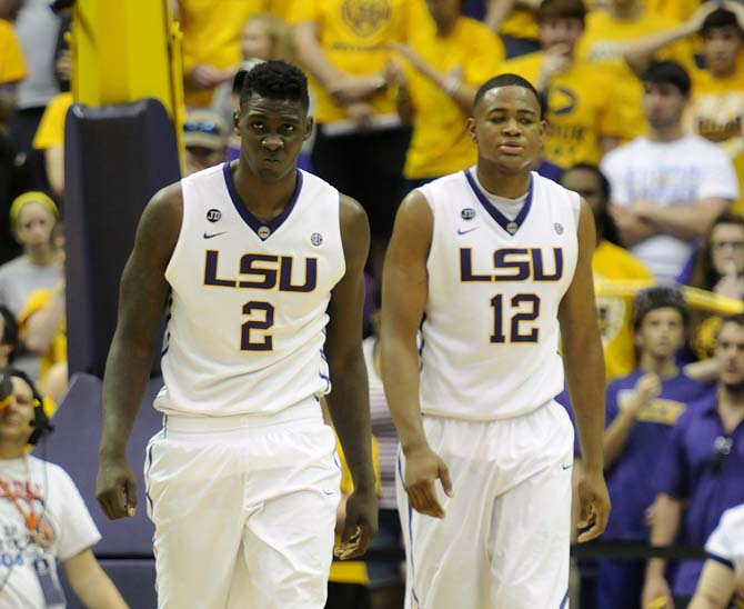 LSU junior forward Johnny O'Bryant (2) and freshman forward Jarell Martin (12) walk down the court after drawing a foul Saturday, March 8 , 2014 during the Tigers' 61-69 loss to Georgia in the PMAC.