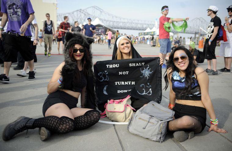 Festival-goers display their flag during Buku Music + Art Project on Friday, March 21, 2014 at Mardi Gras World in New Orleans.