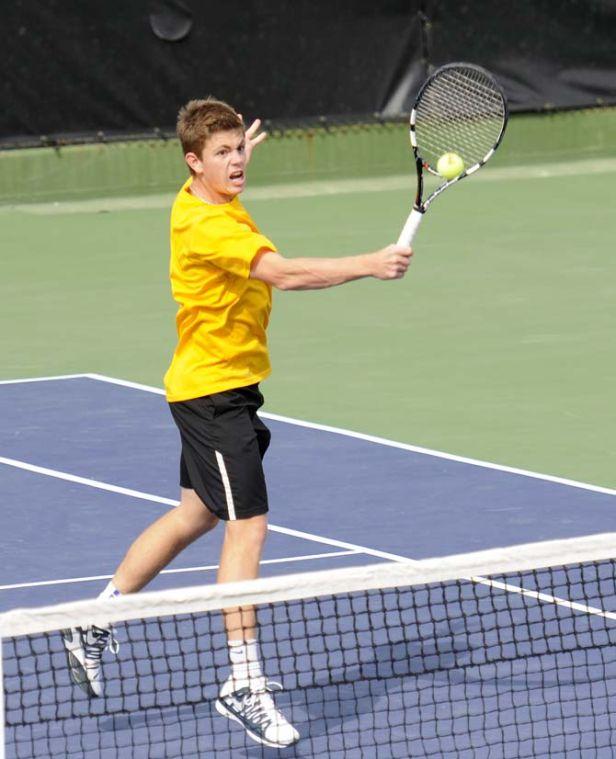 LSU junior Chris Simpson returns the ball Friday, March 7, 2014 during a tennis match against Alabama in W.T. "Dub" Robinson Stadium.