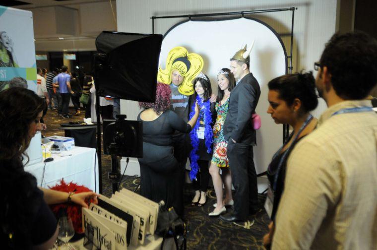 Tribefest event goers pose at the photobooth Sunday, March 16, 2014 at the Sheraton New Orleans Hotel.