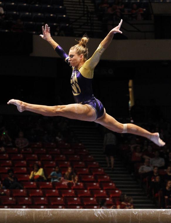 LSU's Kaleigh Dickson competes on the beam during the Southeastern Conference Women's Gymnastics Championship on Saturday, March 22, 2014, in Birmingham, Ala. (AP Photo/Butch Dill)