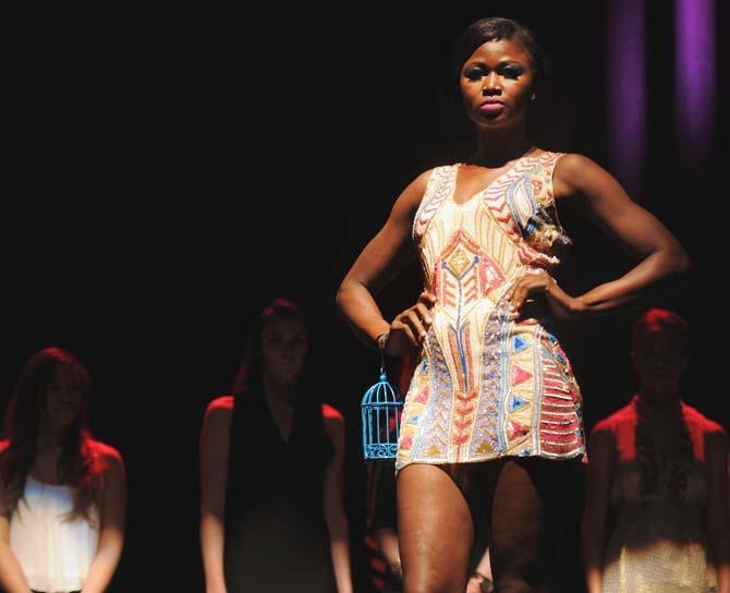 A model showcases the top design by Top Design competitor Sandhya Garg Saturday, March 23, 2014 at Joy Theater for Fashion Week New Orleans Awards Gala.