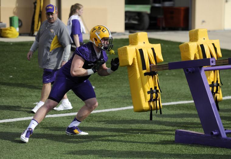 LSU senior linebacker DJ Welter (10) pushes pads Monday, March 10, 2014 during spring practice at the Charles McClendon Practice Facility.