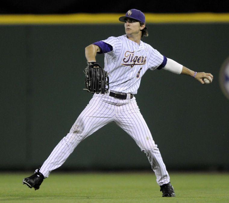 LSU sophomore outfielder Mark Laird (9) throws the ball back infield during the Tigers' 9-0 victory against Southern Alabama on Wednesday, March 19, 2014 at Alex Box Stadium.