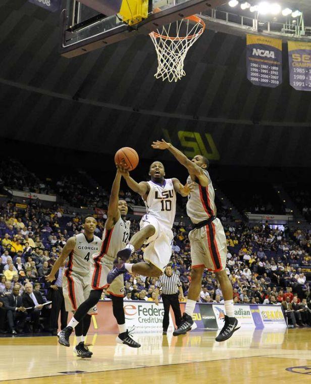 LSU senior guard Andre Stringer (10) weaves toward the basket Saturday, March 8, 2014 during the Tigers' 61-69 loss to Georgia in the PMAC.