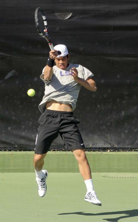 LSU sophomore Tam Trinh hits the ball during a match against George Washinton University on March 13, 2014 at the W.T. &#8220;Dub&#8221; Robinson Stadium.