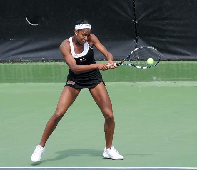 LSU freshman Skylar Holloway hits a volley Sunday, March 9, 2014 during the Lady's Tigers' double match against Auburn at W.T. "Dub" Robinson Stadium.