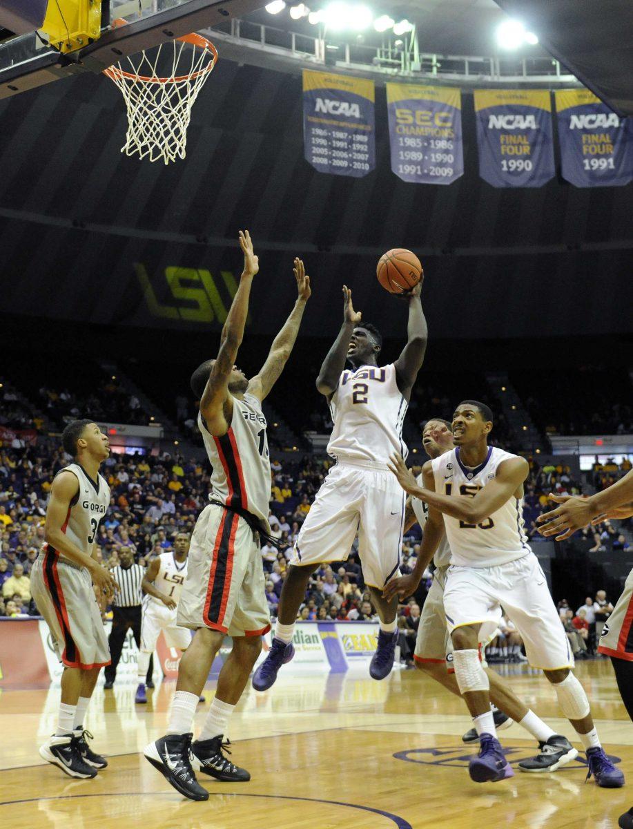 LSU junior forward Johnny O'Bryant III (2) weaves through Georgia defenders Saturday, March 8, 2014 during the Tigers' 61-69 loss to the Bulldogs in the PMAC.