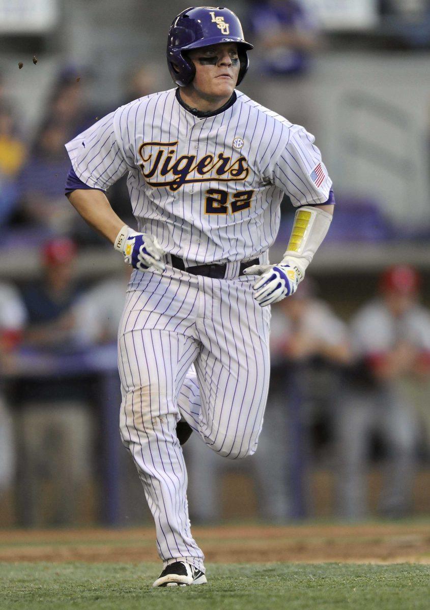 LSU junior catcher Kade Scivicque (22) sprints to first base during the Tigers' 9-0 victory against Southern Alabama on Wednesday, March 19, 2014 at Alex Box Stadium.