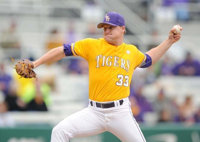 LSU junior pitcher Henri Faucheux (33) pitches the ball Sunday, March 23, 2014 during the Tigers' 2-2 tie against Georgia at Alex Box Stadium.