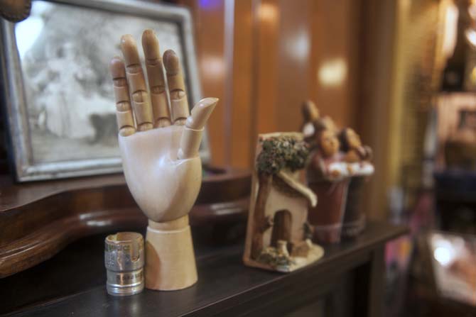 Antique ceramics and a wooden hand are one of many unique items for sale Wednesday, March 26, 2014 at Aladdin's Lamp Antique shop located on Government Street.