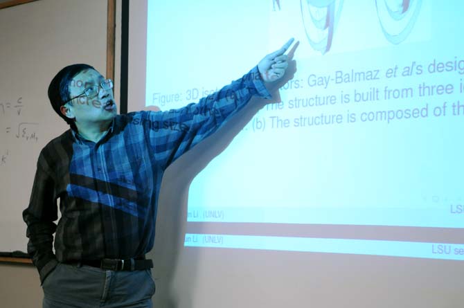 Jichun Li, of the University of Nevada Las Vegas, gives a presentation Tuesday, March 18, 2014, on the mathmatical study and finite element modeling of invisibility cloaks with metamaterials in Lockett Hall.