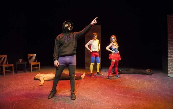 The Hooded Menace (theatre senior Matt Reed) explains his evil plot to Captain Justice (theatre junior Jacob Voisin) and Liberty Lady (theatre junior Yvette Bourgeois) on Sunday during a dress rehearsal of Vampire Cowboy in the Music and Dramatic Arts Building.