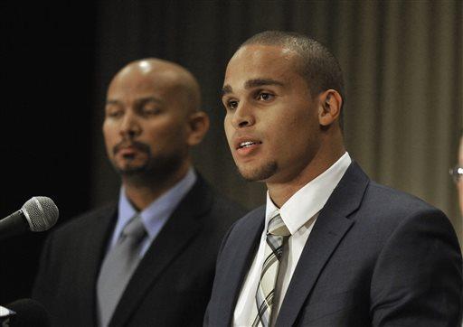 FILE - In this Jan. 28, 2014, file photo, Northwestern quarterback Kain Colter, right, speaks while College Athletes Players Association President Ramogi Huma listens during a news conference in Chicago. In a Wednesday, March 26, 2014, landmark ruling, a federal agency has given football players at Northwestern University the green light to unionize. (AP Photo/Paul Beaty, File)