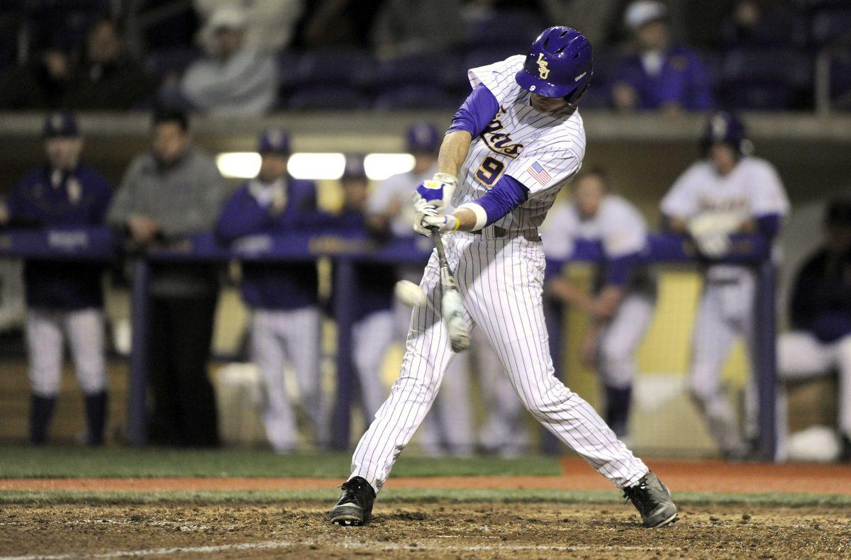 LSU sophomore outfielder Mark Laird (9) hits the ball Wednesday, March 5, 2014 during the Tigers' 8-1 victory against Sacred Heart in Alex Box Stadium.