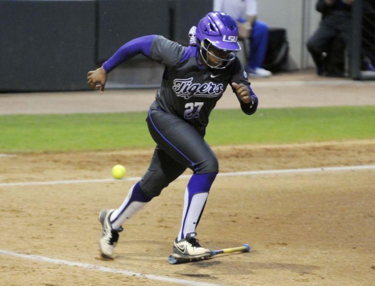 LSU sophomore infielder and pitcher Bianka Bell (27) sprints to first base during the Lady Tigers' 3-2 victory against the Gators on March 15, 2014 at Tiger Park.