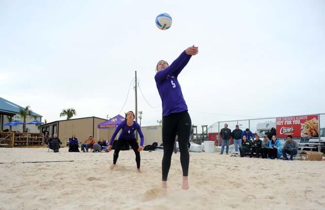LSU sophomore sand volleyball player Katie Lindelow (5) bumps the ball Wednesday, March 26, 2014, during the Tigers' 3-2 lost against Tulane at Coconut Beach Sand Volleyball Complex.