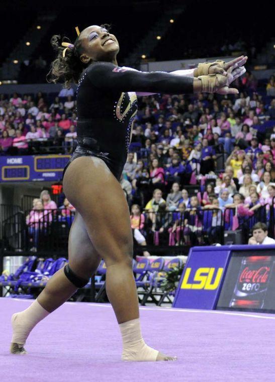 LSU junior all-around gymnast Lloimincia Hall poses during her floor routine Friday, March 7, 2014 during the Tigers' 197.500-195.525 victory against NC State in the PMAC.