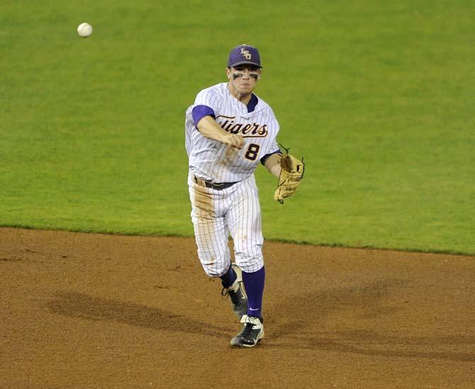 LSU sophomore infielder Alex Bregman (8) throws toward first Tuesday, March 11, 2014 during the Tigers' 5-3 win against Nicholls State in Alex Box Stadium.