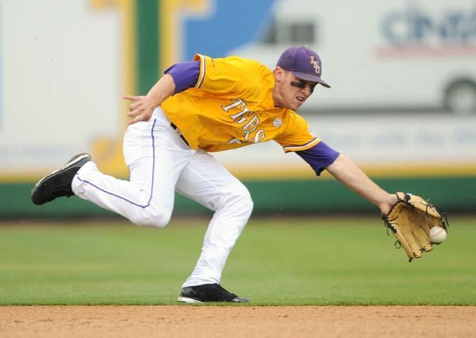 LSU sophomore infielder Alex Bregman (8) catches the ball Sunday, March 23, 2014 during the Tigers' 2-2 tie against Georgia at Alex Box Stadium.