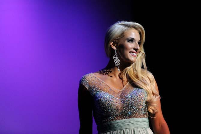 LSU Fashion Merchandising major Anna Kirksey shows off her evening gown Sunday, March 23, 2014, at the Miss LSU-USA pageant in the Union Theatre.