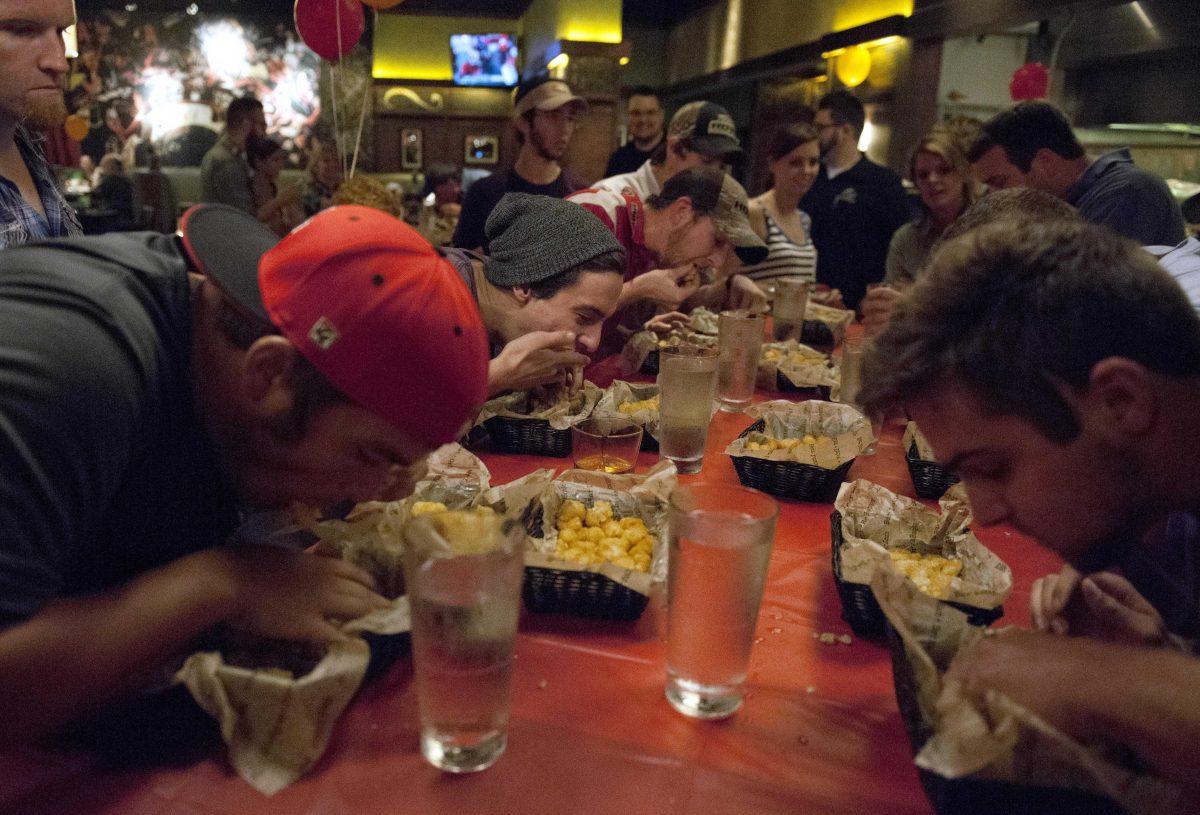 Contestants race against time Thursday night, Sept. 19, 2013 at Bar Louie Rock The Tot eating competition.