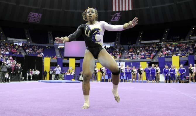 LSU junior all-around gymnast Lloimincia Hall dances during her floor routine Friday, March 7, 2014 during the Tigers' 197.500-195.525 victory against NC State in the PMAC.