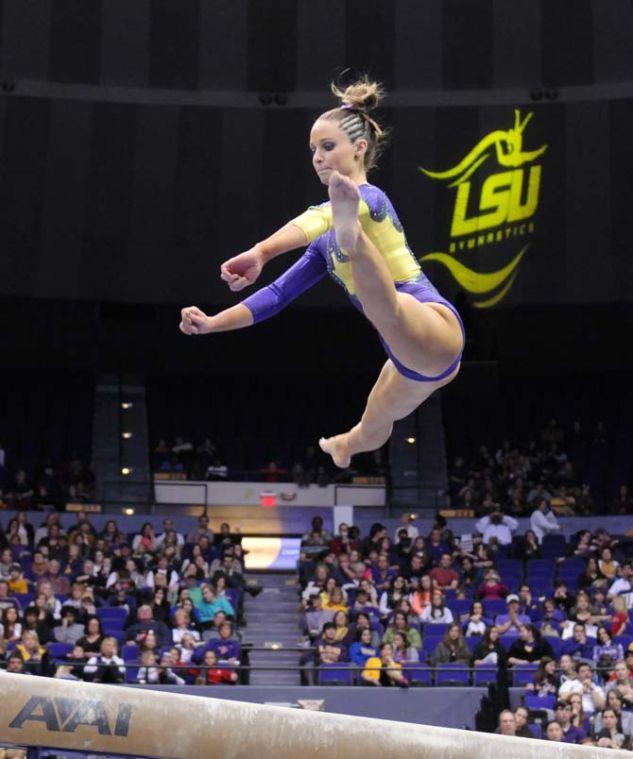 LSU junior all-around gymnast Jessie Jordan jumps on the beam Friday, Feb. 28, 2014 during the Tigers' 198.050-194.825 victory against Missouri at the PMAC.