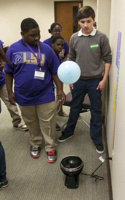 Middle school students experiment with payload Friday, March 28, 2014, during Space Day at Patrick F. Taylor Hall.