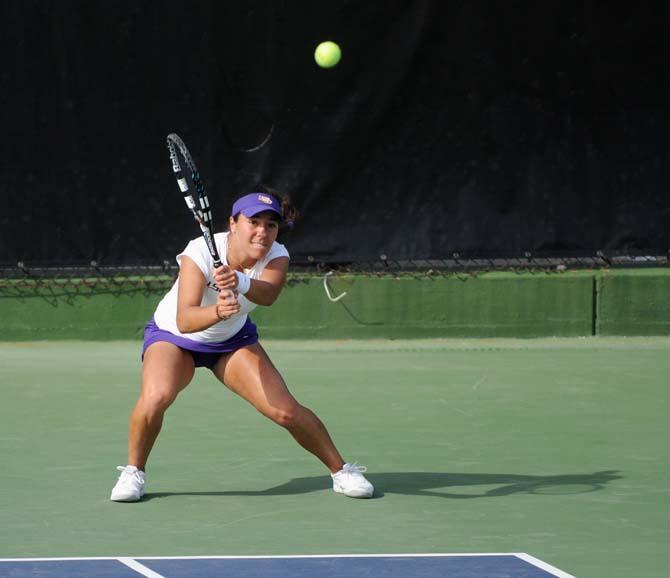 LSU freshman Joana Vale Costa anticipates the ball Friday, March 21, 2014 during a doubles match against Mississippi State at W.T. "Dub" Robinson Stadium.