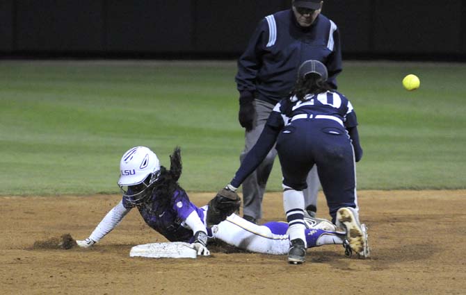 LSU junior outfielder A.J. Andrews (6) steals second base Friday, Feb. 28, 2014 during the Lady Tigers' 8-0 victory against the Lady Harvard Crimson during day one of the Gold and Purple Challenge at Tiger Park.