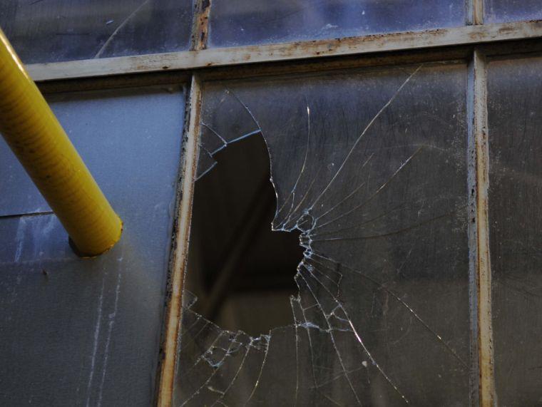 One of several glass window panes that are broken and unrepaired at the Studio Arts Building.