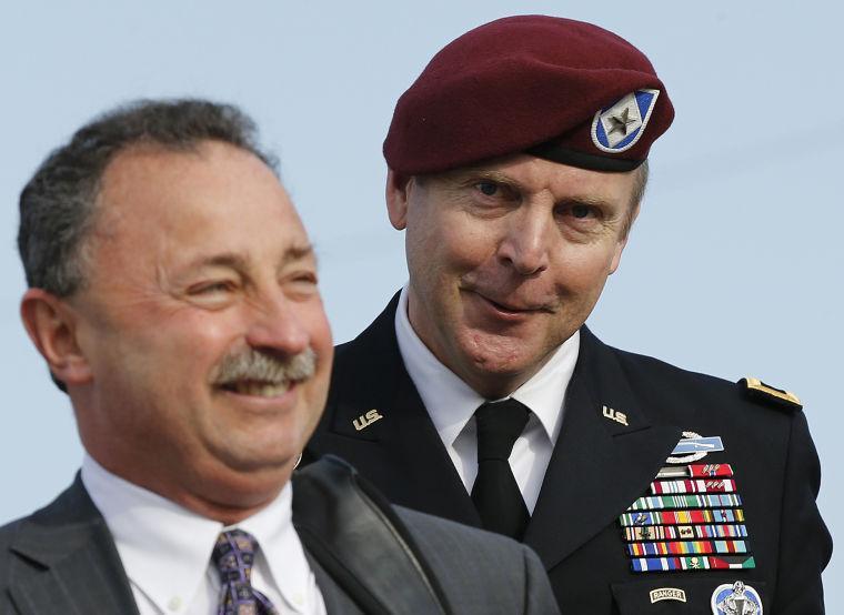 Brig. Gen. Jeffrey Sinclair, right, who admitted to inappropriate relationships with three subordinates, arrives at the courthouse with attorney Richard Scheff for sentencing Fort Bragg, N.C., Thursday, March 20, 2014. (AP Photo/Ellen Ozier)