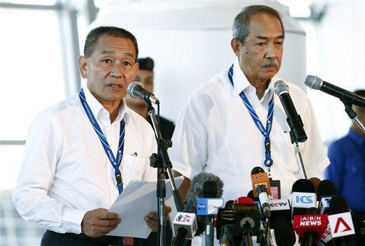 Malaysia Airlines Group CEO Ahmad Jauhari Yahya, left, speaks during a press conference as Nor Yusof, chairman of Malaysia Airlines listens at Kuala Lumpur International Airport in Sepang, Malaysia, Tuesday, March 25, 2014. China demanded Tuesday that Malaysia turn over satellite data used to conclude that a Malaysia Airlines passenger jet was lost in the southern Indian Ocean with no survivors during a flight to Beijing. (AP Photo/Vincent Thian)