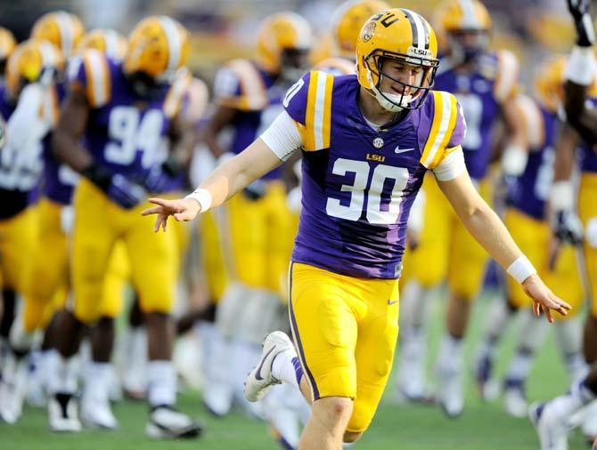 LSU junior placekicker James Hairston (30) runs off the field Saturday, September 14, 2013 before the Tigers' 45-13 victory against Kent State.