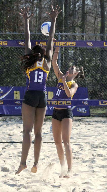 LSU freshman Katarina Raicevic (11) tries to spike the ball through freshman Briana Holman on Wednesday, March 12, 2014 during a scrimmage at Mango's Outdoor Volleyball.