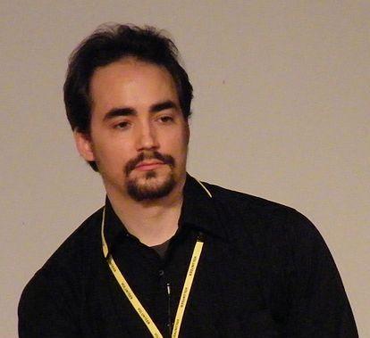 A photo taken of Peter Joseph as he answers questions at the Q&amp;A session after the Zeitgeist: Moving Forward screening the day before Zday 2011.