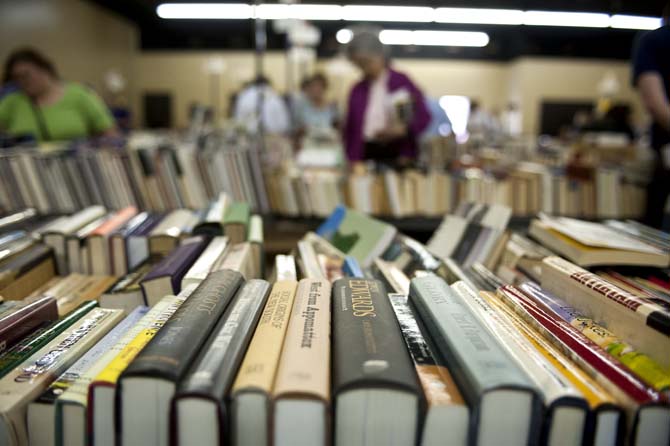 Books are displayed on a table for shoppers at the LSU Libraries Friends of the Libraries Annual Book Bazaar on Thursday, March 20, 2014 in the 4-H mini barn.