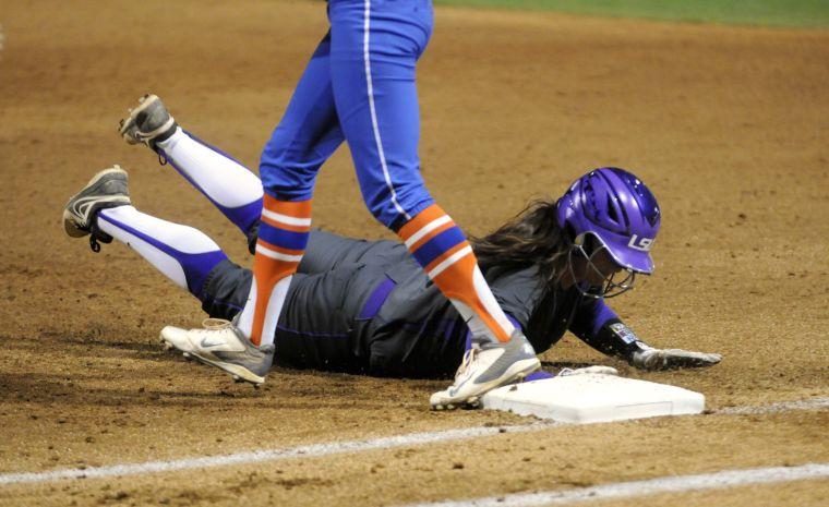 LSU senior infielder Tammy Wray (18) dives for the base during the Lady Tigers' 3-2 victory against the Gators on March 15, 2014 at Tiger Park.