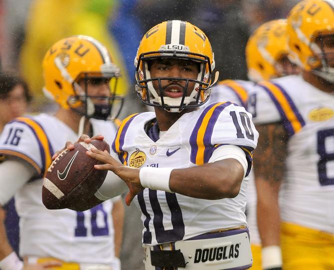 LSU freshman quarterback Anthony Jennings (10) warms up Wednesday, Jan. 1, 2014 before the Tigers' 21-14 victory against the Iowa Hawkeyes in the Outback Bowl at Raymond James Stadium in Tampa, Florida.