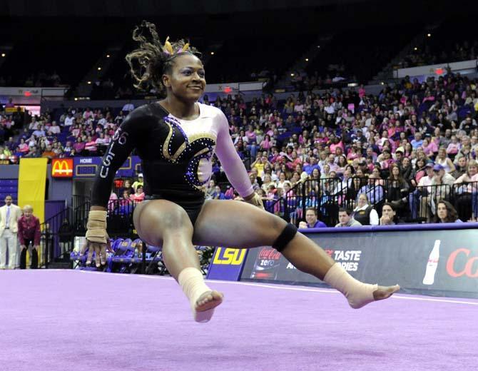 LSU junior all-around gymnast Lloimincia Hall bounces off the ground during her floor routine Friday, March 7, 2014 during the Tigers' 197.500-195.525 victory against NC State in the PMAC.