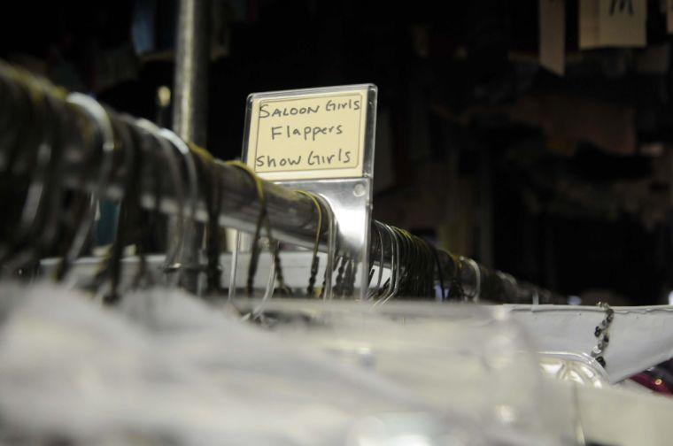 Labels on the racks at Southern Costume Company help costumers find the garments that customers want.